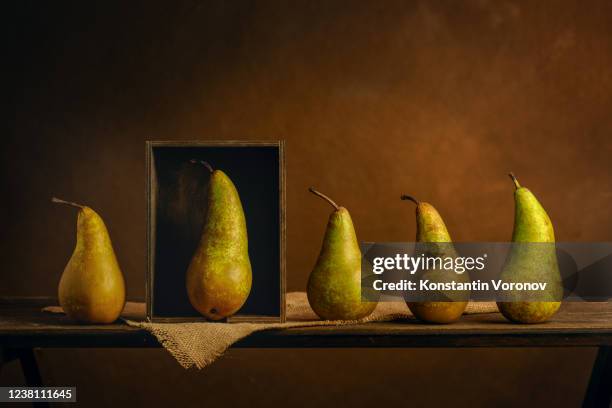 scene played with pears. metaphor. exclusivity concept. personal boundaries, isolation, quarantine - vorurteil stock-fotos und bilder