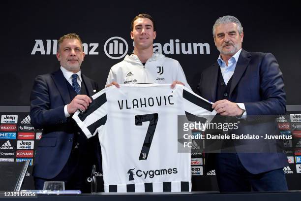 Juventus new signing Dusan Vlahovic pictured with Federico Cherubini and Maurizio Arrivabene during a press conference on February 1, 2022 in Turin,...