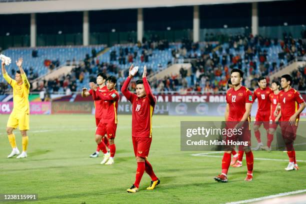 Vietnams team reacts after the FIFA World Cup Asian Qualifier final round Group B match between Vietnam and China at My Dinh National stadium on...