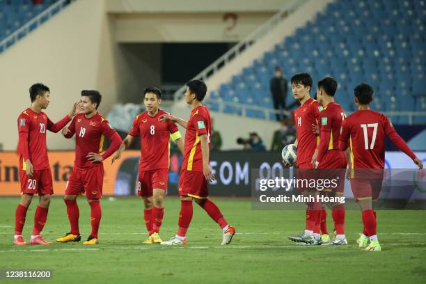 Vietnams team reacts after the FIFA World Cup Asian Qualifier final round Group B match between Vietnam and China at My Dinh National stadium on...