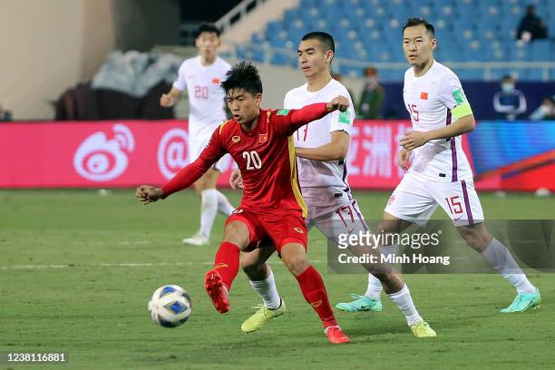 Vietnams Phan Van Duc fights for the ball with Chinas Liu Binbin during the FIFA World Cup Asian Qualifier final round Group B match between Vietnam...