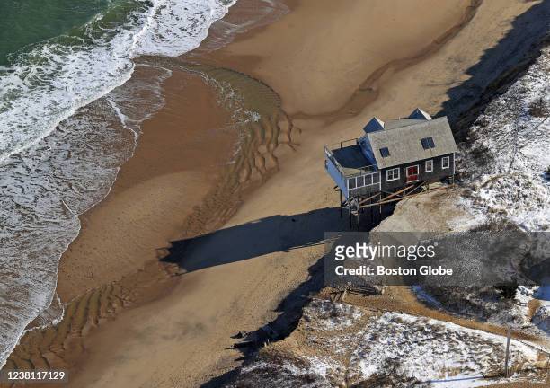 Truro, MA An aerial view of a home on pilings at the edge due to erosion by the ocean in Truro Cape Cod on South Pamet Road in Truro, MA on Jan. 31,...