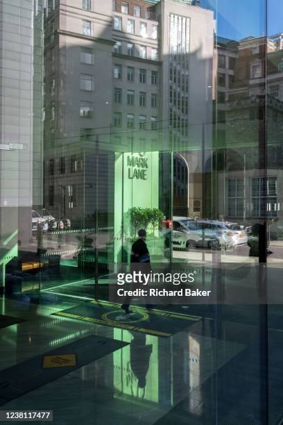 Reflected green light illuminates an office foyer in the City of London, a day before the Prime Minister flies to Ukraine, amid tensions between...