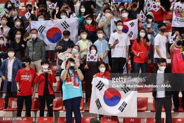 Fans of Korea Republic celebrate during the FIFA World Cup Qatar 2022 Qualifier match between Syria and South Korea at Al Rashid Stadium on February...