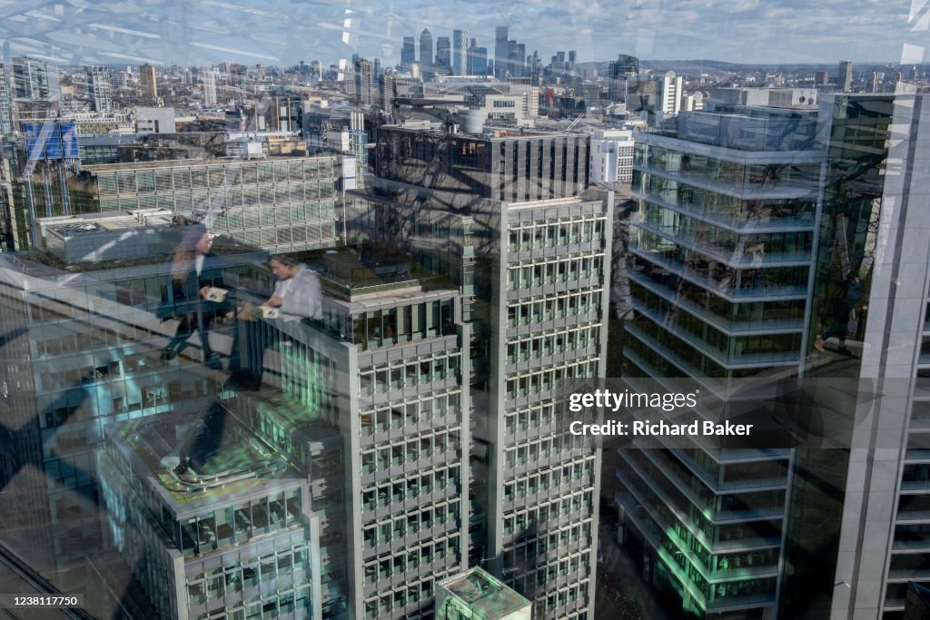 Women Sit Above The City Of London