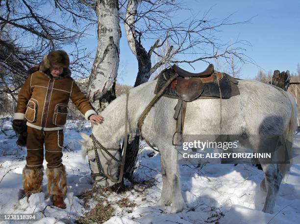 Picture released on March 6, 2010 shows Russian Prime Minister Vladimir Putin taking a horseback ride in the Karatash area, near the town of Abakan,...