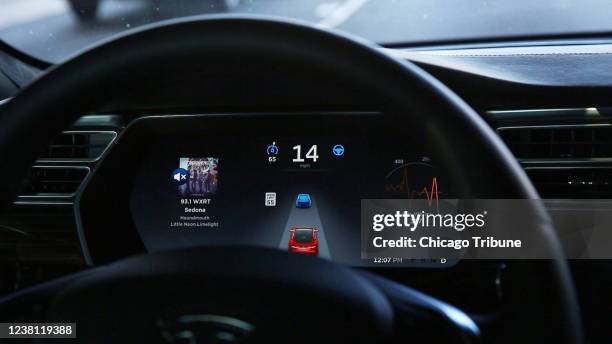 The dashboard of the software-updated Tesla Model S P90D shows the icons enabling Tesla&apos;s autopilot, featuring limited hands-free steering.