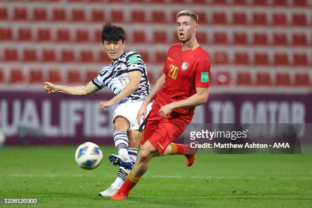 Lee Dong-jun of Korea Republic and Oliver Kass Kawo of Syria during the FIFA World Cup Qatar 2022 Qualifier between Syria and South Korea at Al...