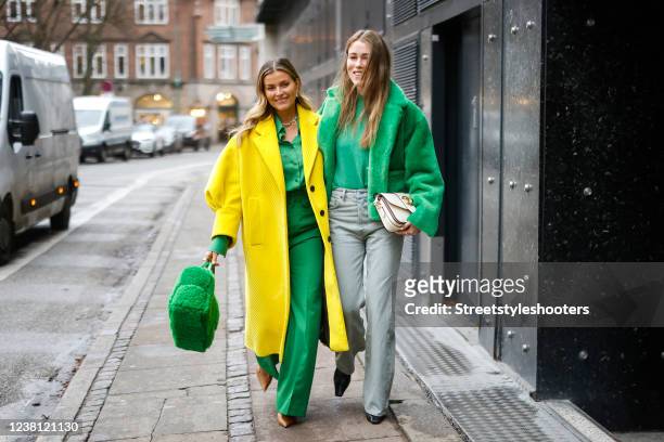 Influencer Janka Polliani wearing a yellow coat by Prada, a green blouse by Gucci, matching green wide leg pants by Gucci, a green fuzzy bag by...