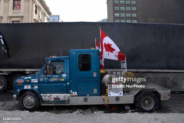 Trucks lined up with banners and signs next to the Parliament building during the 4th Day of Trucker's protest against the mandatory vaccine policy...