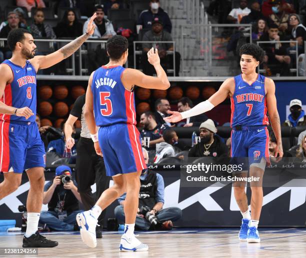 Killian Hayes of the Detroit Pistons high fives Frank Jackson of the Detroit Pistons during the game against the New Orleans Pelicans on February 1,...