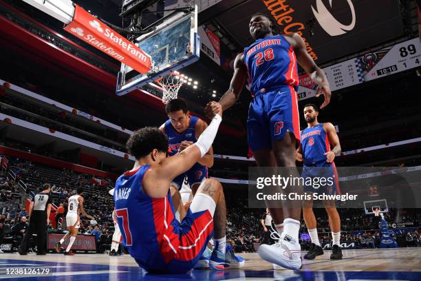 Frank Jackson and Isaiah Stewart help Killian Hayes of the Detroit Pistons during the game against the New Orleans Pelicans on February 1, 2022 at...