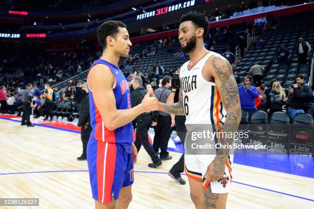 Frank Jackson of the Detroit Pistons high fives Nickeil Alexander-Walker of the New Orleans Pelicans after the game on February 1, 2022 at Little...