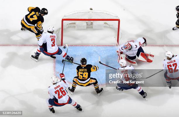 Bryan Rust of the Pittsburgh Penguins scores a goal past Ilya Samsonov of the Washington Capitals at PPG PAINTS Arena on February 1, 2022 in...