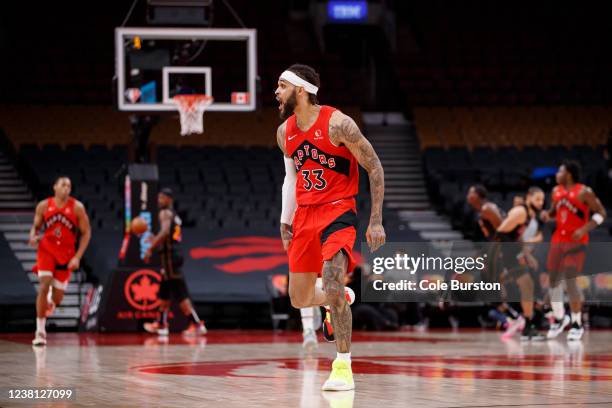 Gary Trent Jr. #33 of the Toronto Raptors reacts after knocking down a three pointer during the second half of their NBA game against the Miami Heat...