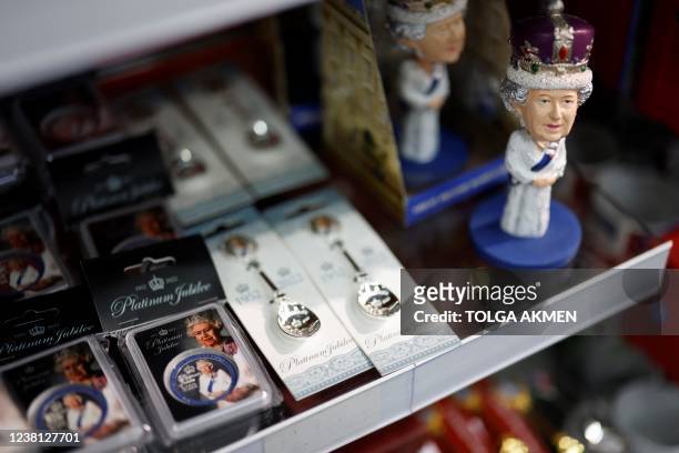 Souvenirs marking the Platinum Jubilee of Britain's Queen Elizabeth II are seen on display inside the Cool Britannia souvenir shop close to...