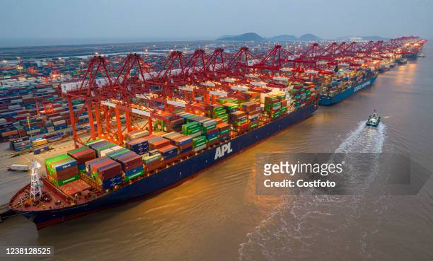 An aerial photo taken on February 2, 2022 shows large container ships in operation at Yangshan Port in Shanghai, China. In January 2022, the...