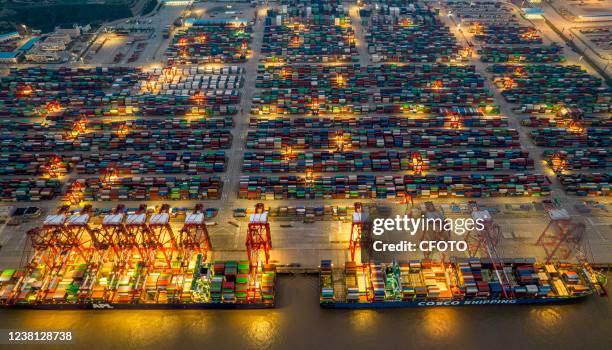 An aerial photo taken on February 2, 2022 shows large container ships in operation at Yangshan Port in Shanghai, China. In January 2022, the...