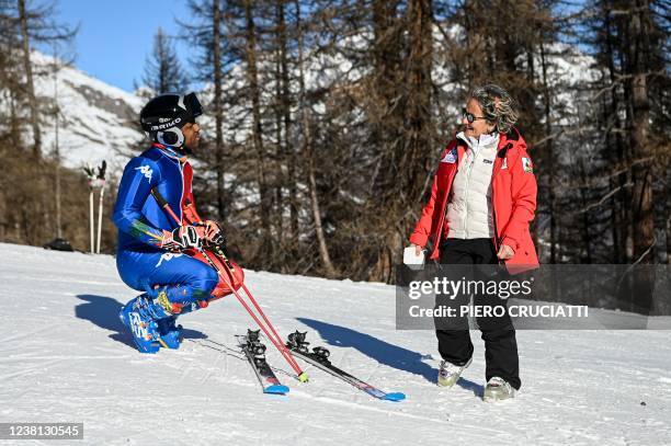 Haitian skier Richardson Viano, who qualified to defend the colors of Haiti at the upcoming Beijing 2022 Olympic Winter Games, talks with his mother...