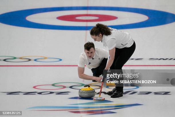 Britain's Bruce Mouat and Jennifer Dodds compete during the mixed doubles round robin session 1 game of the Beijing 2022 Winter Olympic Games curling...