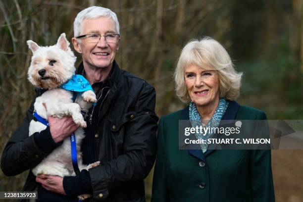 Britain's Camilla, Duchess of Cornwall poses with Battersea Ambassador, Paul O'Grady during her visit to Battersea Brand Hatch Centre on February 2,...