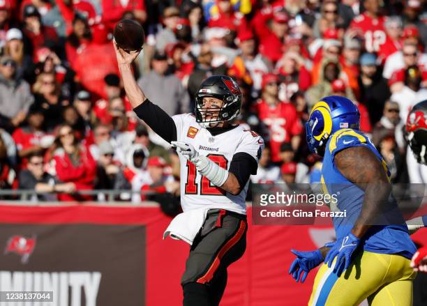 Tampa Bay Buccaneers quarterback Tom Brady makes a pass against Los Angeles Rams defensive end A'Shawn Robinson in the NFC Divisional game at Raymond...