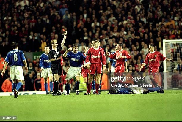 Steven Gerrard of Liverpool is shown the red card after his foul on Everton's Kevin Campbell during the FA Premier League match between Liverpool and...