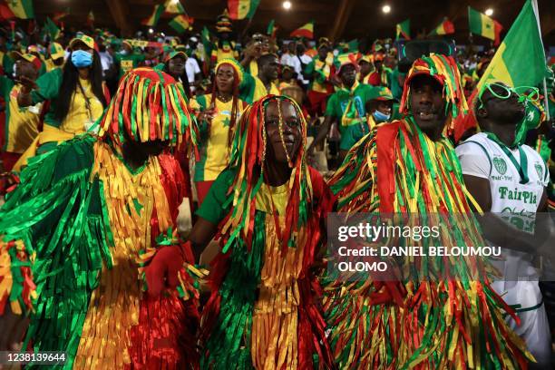 Disguised Senegal's football fans react before the Africa Cup of Nations 2021 semi final football match between Burkina Faso and Senegal at Stade...