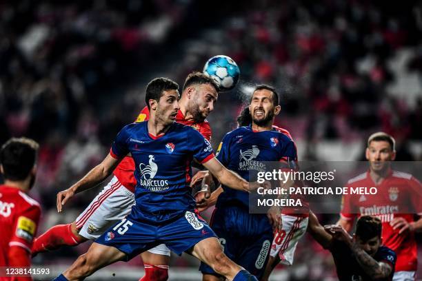 Benfica's Argentine defender Nicolas Otamendi heads the ball with Gil Vicente's Portuguese defender Ruben Fernandes during the Portuguese league...