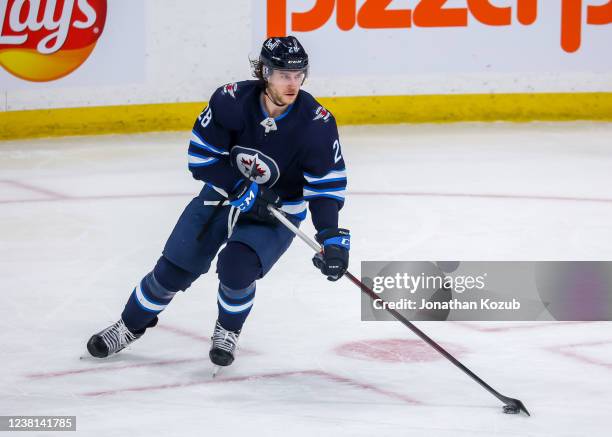 Nathan Beaulieu of the Winnipeg Jets plays the puck during third period action against the Vancouver Canucks at Canada Life Centre on January 27,...