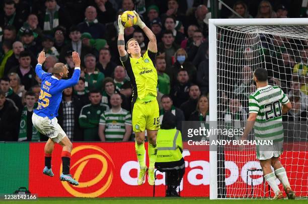 Celtic's English midfielder Joe Hart jumps to make a save during the Scottish Premiership football match between Celtic and Rangers at Celtic Park...