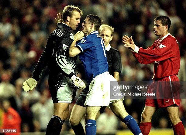 Sander Westerveld of Liverpool wrestles with Francis Jeffers of Everton during the FA Premier League match between Liverpool and Everton played at...