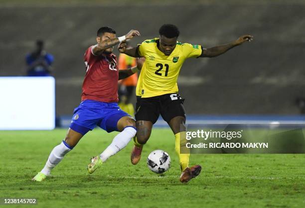 Costa Rica's Ronald Matarrita vies for the ball with Jamaica's Javain Brown during the World Cup Qualifier CONCACAF match between Jamaica and Costa...