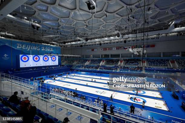 General view shows athletes competing during the mixed doubles round robin session 2 games of the Beijing 2022 Winter Olympic Games curling...