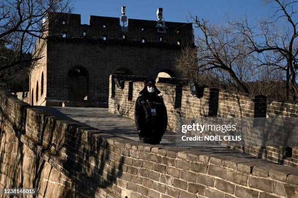 Security personnel is seen at the Badaling Great Wall on the second day of the torch relay in Beijing on February 3 a day before the start of the...