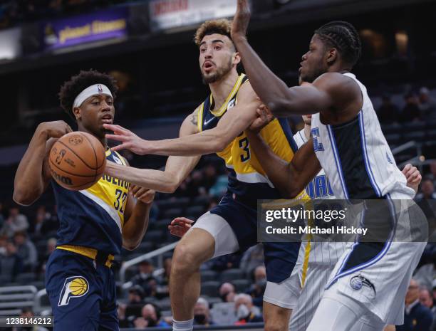 Chris Duarte of the Indiana Pacers drives thru the lane against Mo Bamba of the Orlando Magic during the first half at Gainbridge Fieldhouse on...