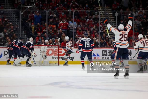 Ryan Nugent-Hopkins of the Edmonton Oilers stuffs in the game winning goal against the Washington Capitals at Capital One Arena on February 2, 2022...