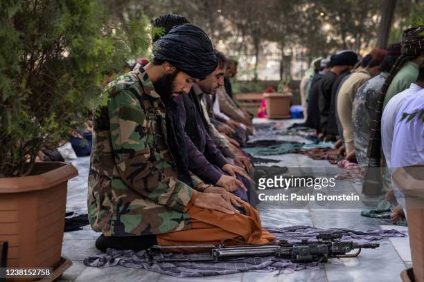Taliban pray at sunset at the Kabul Zoo on September 24, 2021 in Kabul, Afghanistan.