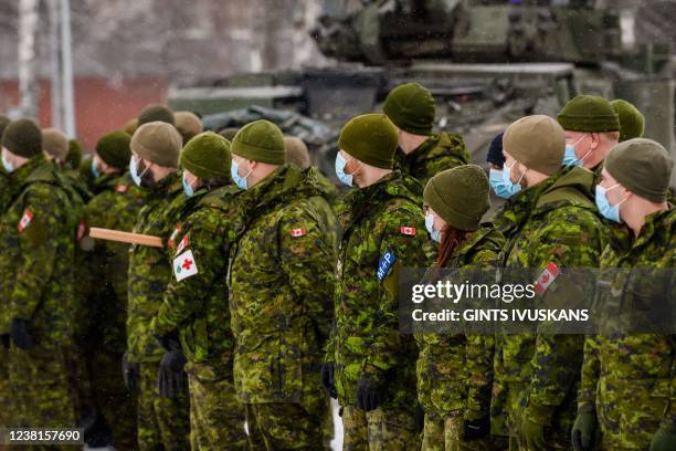Canadian soldiers wait to meet Canada's Minister of Defence in Adazi, Latvia, on February 3, 2022.