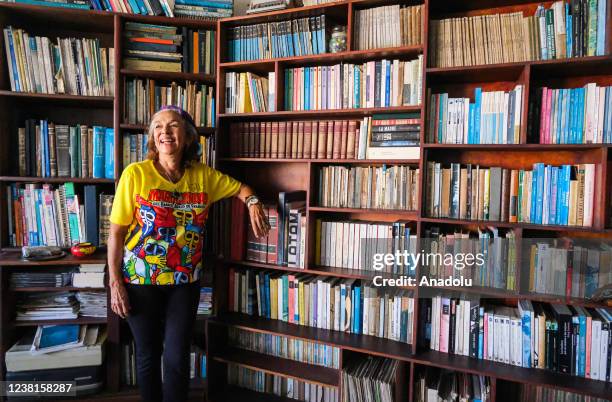 Years old Agustina Fuentemayor, one of the oldest women in the comparsa, she poses for a portrait with all her book in her apartment in Barranquilla,...