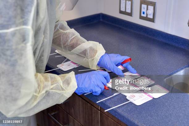 Healthcare worker conducts a Covid-19 rapid test at a drive through testing site in Cruz Bay, Saint John, U.S. Virgin Islands, U.S., on Wednesday,...