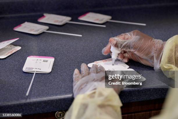 Healthcare worker conducts a Covid-19 rapid test at a drive through testing site in Cruz Bay, Saint John, U.S. Virgin Islands, U.S., on Wednesday,...