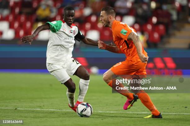 Abdoulay Diaby of Al Jazira Club and Sylvain Graglia of AS Pirae during the FIFA Club World Cup UAE 2021 1st Round match between Al Jazira Club and...