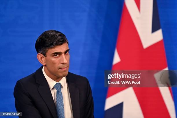 Britain's Chancellor of the Exchequer Rishi Sunak hosts a press conference in the Downing Street Briefing Room on February 3, 2022 in London,...