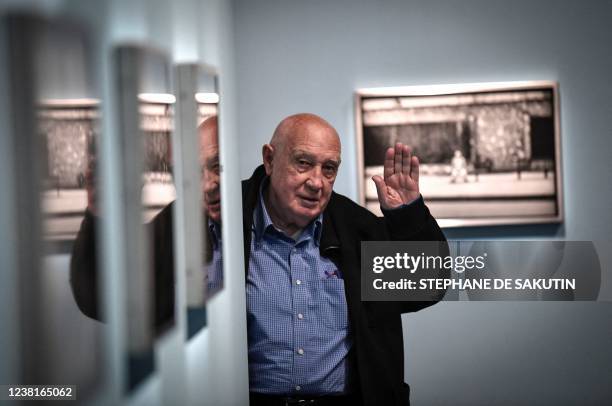 French photographer and director Raymond Depardon poses during a photo session at his exhibition titled "Son oeil dans ma main" at the Arab World...