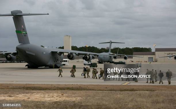 Troops deploy for Europe from Pope Army Airfield at Fort Bragg, North Carolina, on February 3, 2022. - The US plans to deploy 3,000 troops to fortify...