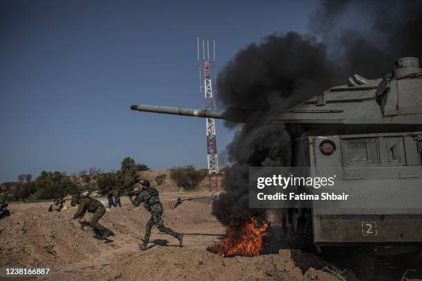 Palestinian actors and crew shoot a scene for the series "Qabdat al-Ahrar," meaning "Fist of the Free" in Arabic, in Beit Lahia in the northern Gaza...