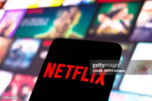 In this photo illustration, the Netflix logo seen displayed on a smartphone screen.