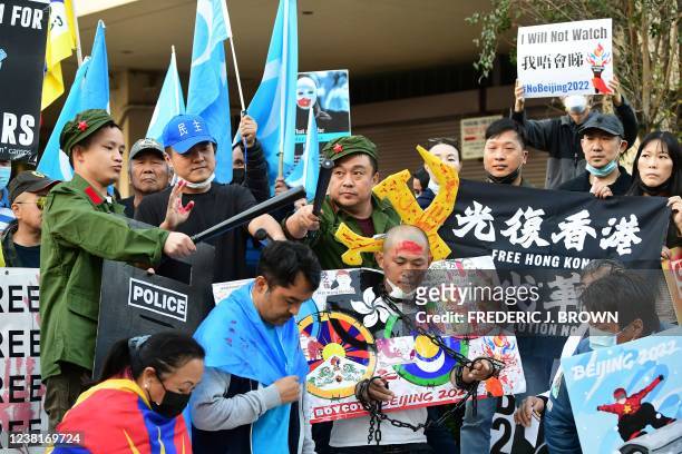 Activists protest against the 2022 Beijing Winter Olympics outside the Consulate of China in Los Angeles, California on February 3, 2022. - Activists...
