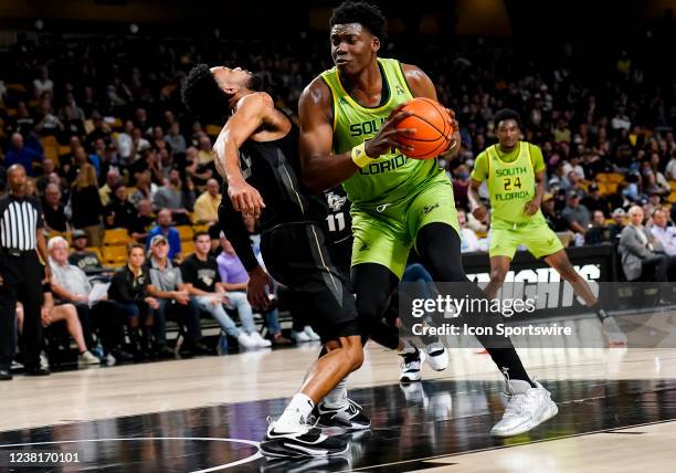 South Florida Bulls center Russel Tchewa gets a charging foul during the basketball game between the UCF Knights and the and the South Florida on...